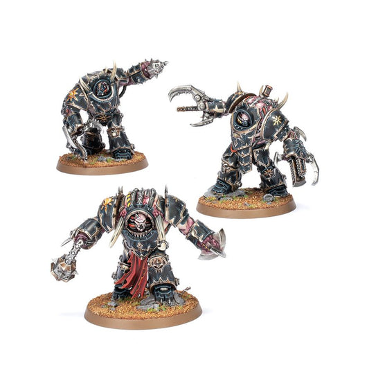 Painted Chaos Space Marines Mutilators miniatures showing daemonic fused armour and close-combat weapons